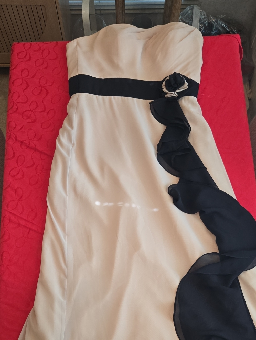 Elegant Cream Strapless Gown with Black Ruffle Trim